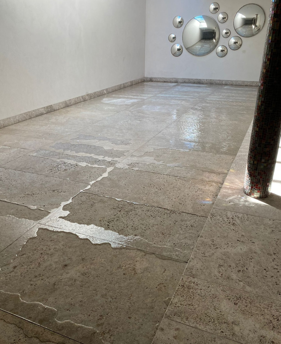 Pool with moveable floor in grey stone